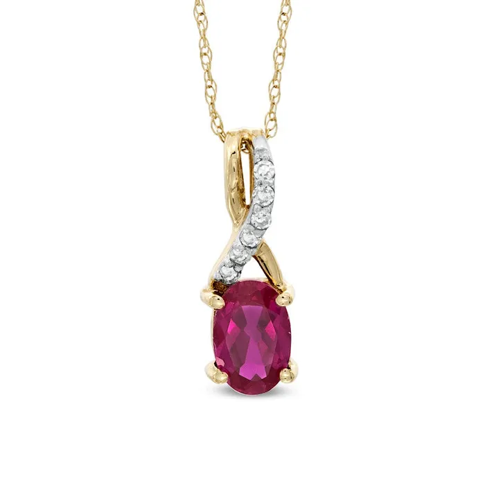 Oval LabCreated Ruby and Diamond Accent Twist Pendant in 10K Yellow Gold Goldia Necklaces