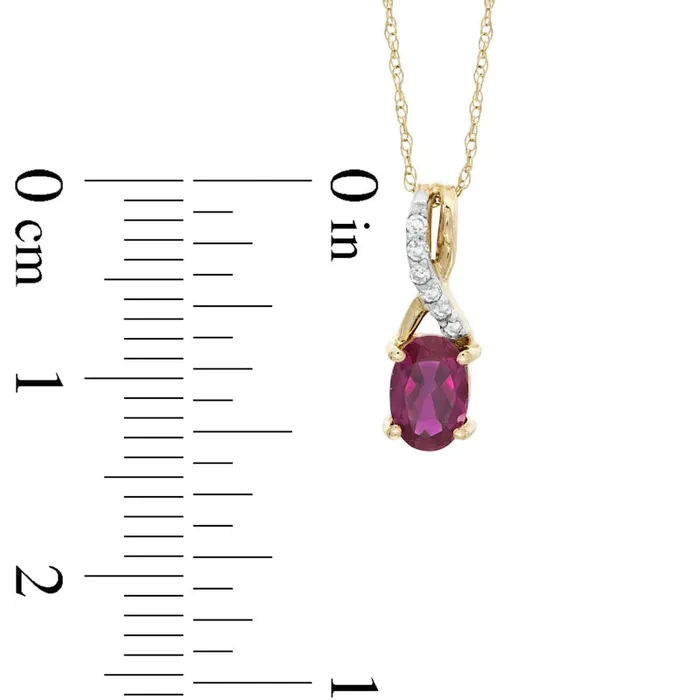 Oval LabCreated Ruby and Diamond Accent Twist Pendant in 10K Yellow Gold Goldia Necklaces Oval LabCreated Ruby and Diamond Accent Twist Pendant in 10K Yellow Gold Goldia Necklaces